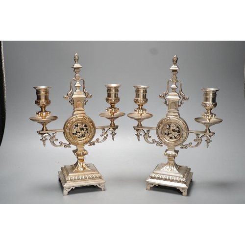 1264 - A pair of Winn & Co., Birmingham silvered brass two branch candelabra - 28.9cm high