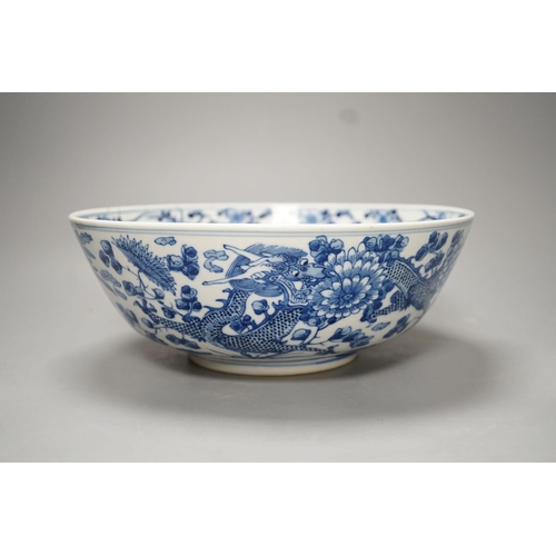 1270 - A 19th-century Chinese blue and white dragon bowl - 27cm diameter