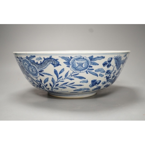 1270 - A 19th-century Chinese blue and white dragon bowl - 27cm diameter