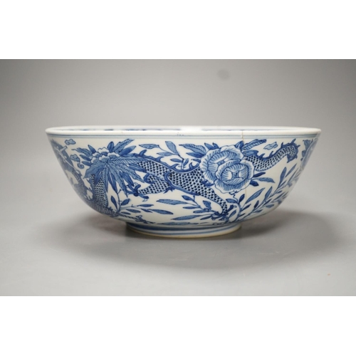 1270 - A 19th-century Chinese blue and white dragon bowl - 27cm diameter