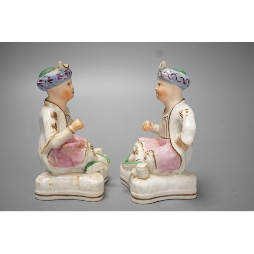 1273 - Two Staffordshire porcelain figures of seated Ottoman Turks - 12.5cm high