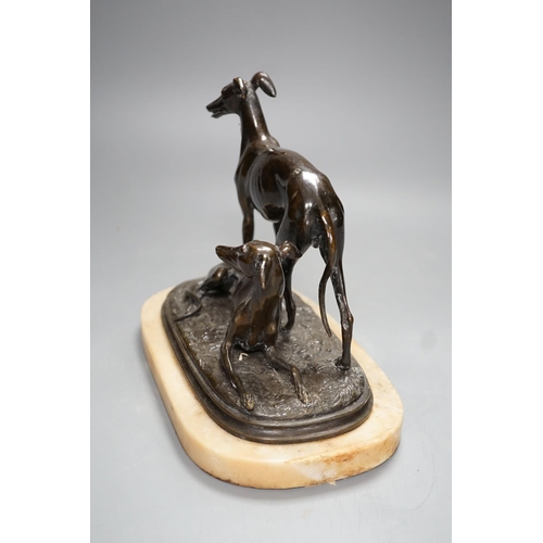 1277 - A bronze sculpture of a greyhounds on alabaster base, one seated and the other standing - 20cm high... 