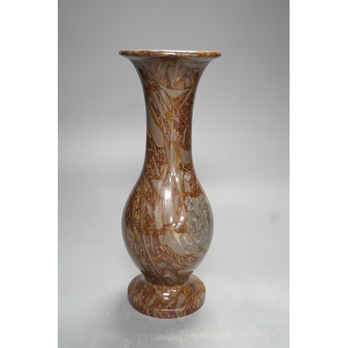 1278 - A pudding stone vase - 28cm high