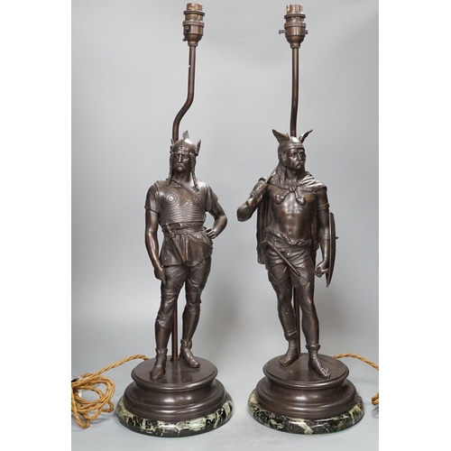 1287 - A pair of spelter warrior lamps on marbled plinth base - 62cm high