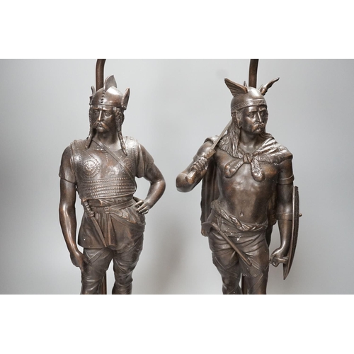 1287 - A pair of spelter warrior lamps on marbled plinth base - 62cm high