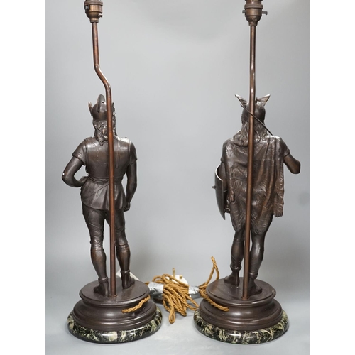 1287 - A pair of spelter warrior lamps on marbled plinth base - 62cm high