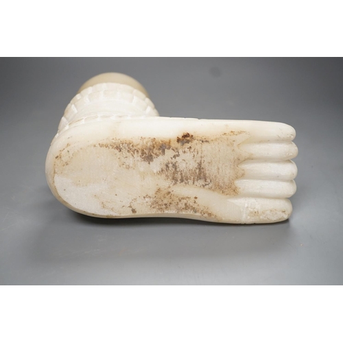 1289 - An Indian white marble foot of a deity - 18cm high