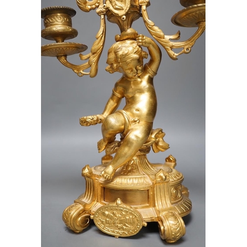 1294 - A pair of Louis XVI style ormolu cherub candelabra, late 19th century,  31cm