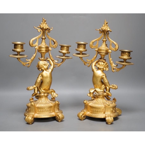 1294 - A pair of Louis XVI style ormolu cherub candelabra, late 19th century,  31cm