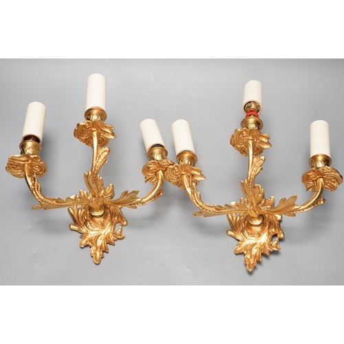 1297 - A pair of ormolu three branch wall lights