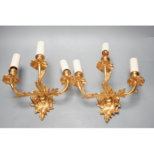 1297 - A pair of ormolu three branch wall lights