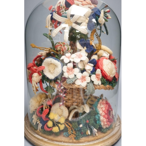 1300 - Victorian woolwork model of a bouquet of flowers under a glass dome - 40cm high