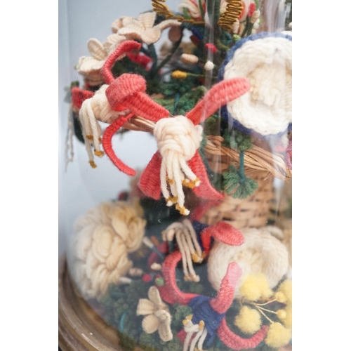 1300 - Victorian woolwork model of a bouquet of flowers under a glass dome - 40cm high