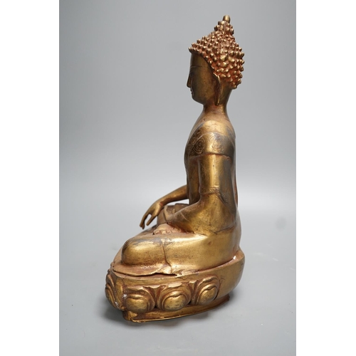 1311 - A gilt brass seated figure of Buddha - 38cm high