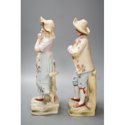 1328 - A pair of bisque figures - 34.5cm