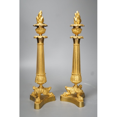 1330 - A pair of Louis XVI style ormolu candlesticks with torched stoppers - 32cm high