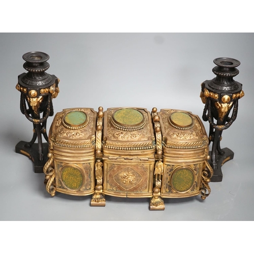 1348 - A French gilt metal casket inset with reverse painted glass panels and a pair of ormolu style candle... 