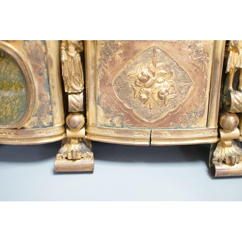 1348 - A French gilt metal casket inset with reverse painted glass panels and a pair of ormolu style candle... 