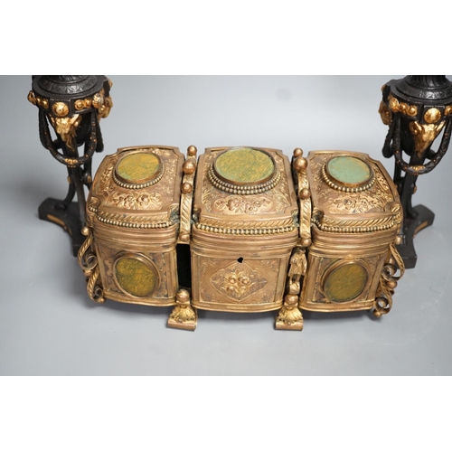 1348 - A French gilt metal casket inset with reverse painted glass panels and a pair of ormolu style candle... 