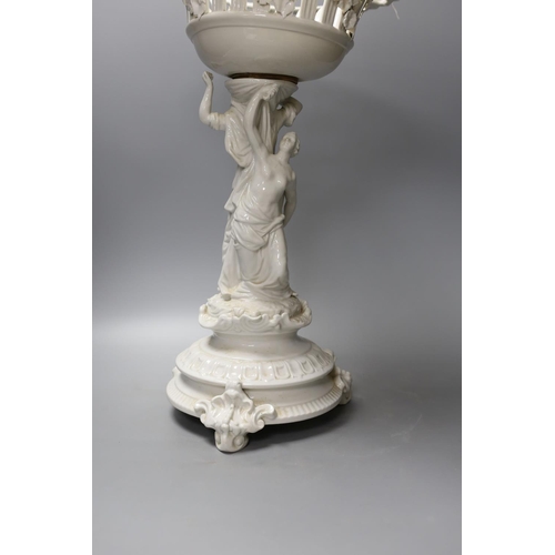 1361 - A Continental white glazed porcelain centrepiece bowl modelled with two maidens - 47cm tall... 