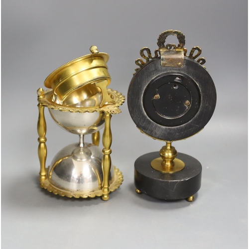 1374 - An ormolu and silver plated hourglass shaped desk aneroid barometer and a gilt metal and parcel ebon... 