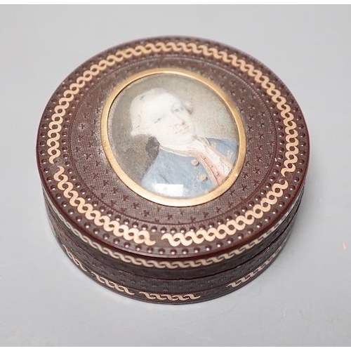 1557 - A 19th century pressed bois durci and gilt metal snuff box with painted miniature portrait of a gent... 