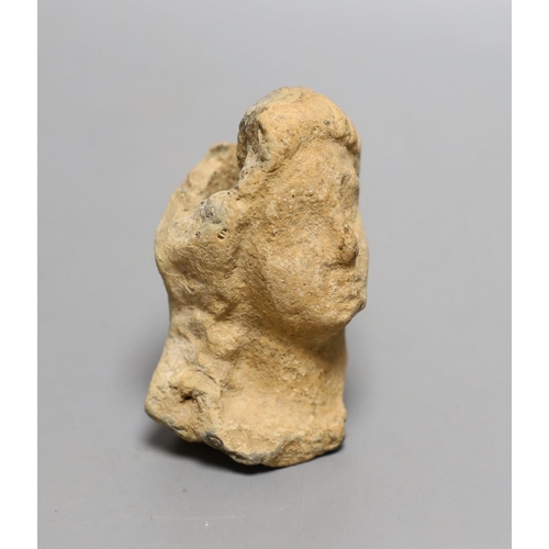 1560 - An antiquity terracotta figure head,8cms high.