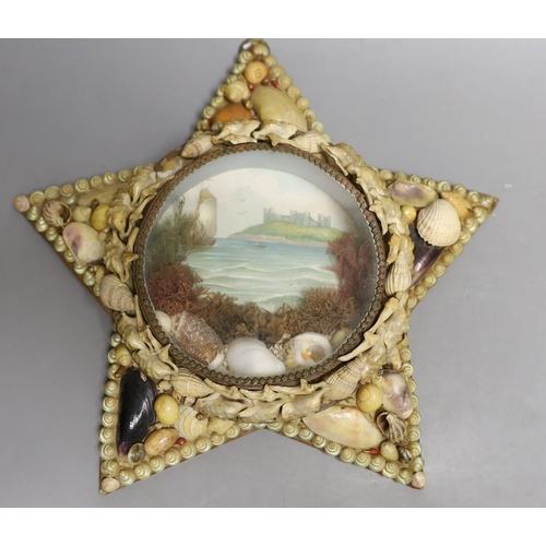 1562 - A shell mounted star with central scenic seascape and a shell hand mirror, star 24 cms wide.... 