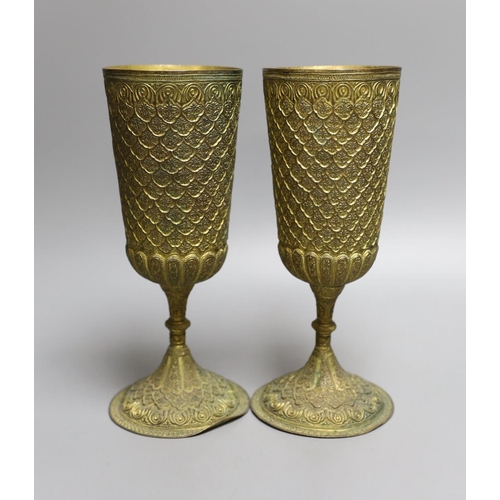 1573 - A pair of ornate gilt metal goblets,22cms high.