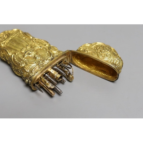 1583 - A George III gilt metal etui containing accessories,10cms high.