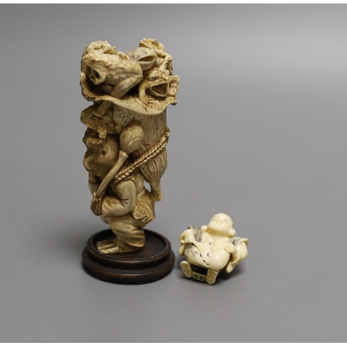 1587 - A Japanese ivory okimono of a monkey carrying a lotus leaf containing toads, on its back and an Ivor... 