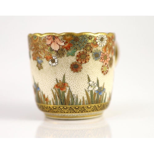 1594 - A Japanese Satsuma pottery cup and saucer, signed Seikozan, Meiji period,painted with flowers and fo... 