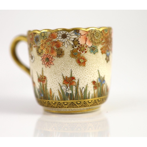 1594 - A Japanese Satsuma pottery cup and saucer, signed Seikozan, Meiji period,painted with flowers and fo... 