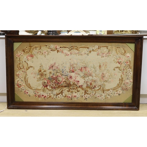 1599 - A rectangular oak framed floral tapestry panel 75x147cm