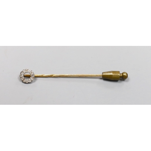 1946 - An Edwardian yellow metal and diamond cluster set stick pin, 58mm, gross 1.4 grams.