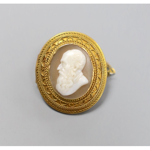 1950 - A late Victorian yellow metal and oval cameo shell set brooch, carved the bust of a gentleman to dex... 