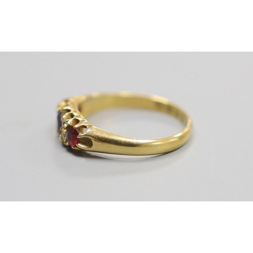 1953 - A late Victorian 18ct gold, three stone ruby and four stone diamond set half hoop ring, size M, gros... 