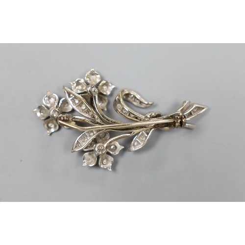 1958 - A 20th century white metal, emerald and diamond set spray brooch, 45mm, gross 10 grams.