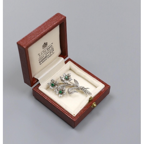 1958 - A 20th century white metal, emerald and diamond set spray brooch, 45mm, gross 10 grams.