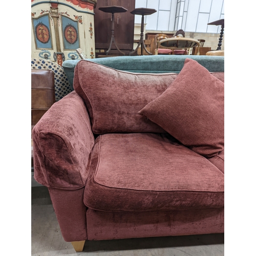 1097 - A contemporary plum fabric two seater settee, length 176cm, depth 84cm, height 86cm