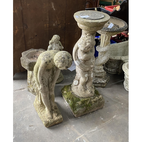 1 - A reconstituted stone figural sundial, a female bather figure, bird bath and one other garden orname... 