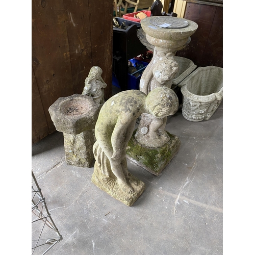 1 - A reconstituted stone figural sundial, a female bather figure, bird bath and one other garden orname... 