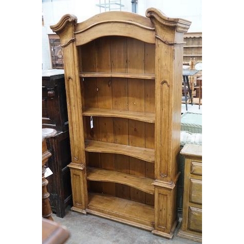 11 - An 18th century style French provincial pine open bookcase, length 116cm, depth 28cm, height 204cm... 