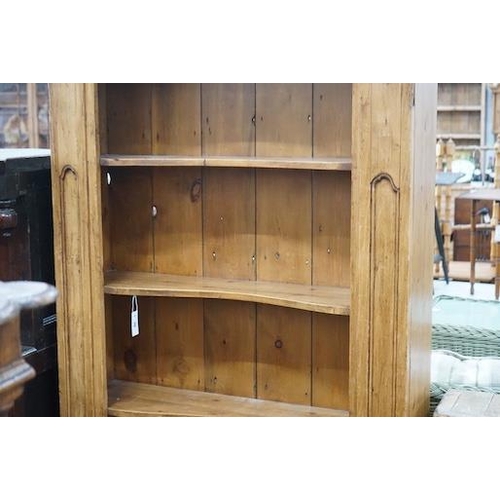 11 - An 18th century style French provincial pine open bookcase, length 116cm, depth 28cm, height 204cm... 