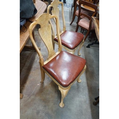 24 - A set of four Queen Anne style pale walnut dining chairs with Merryweather plaques