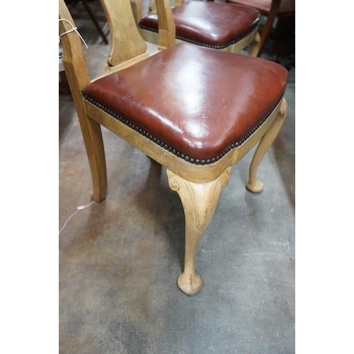 24 - A set of four Queen Anne style pale walnut dining chairs with Merryweather plaques