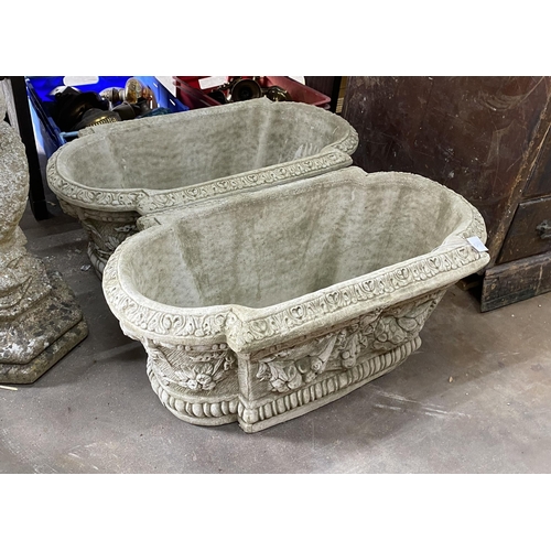 3 - A pair of shaped oval reconstituted stone garden planters with floral swag bodies, width 82cm, depth... 