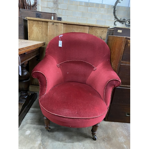 36 - A late Victorian nursing chair upholstered in red dralon, width 78cm, depth 80cm, height 92cm... 