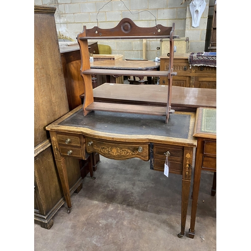 39 - An Edwardian rosewood and marquetry inlaid bow front writing table, width 91cm, depth 49cm, height 7... 