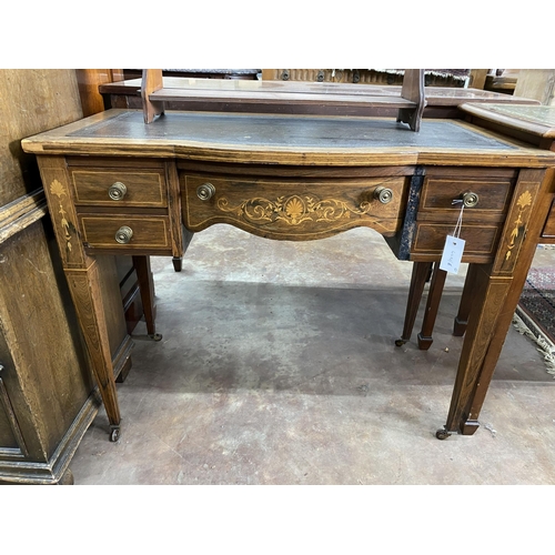 39 - An Edwardian rosewood and marquetry inlaid bow front writing table, width 91cm, depth 49cm, height 7... 